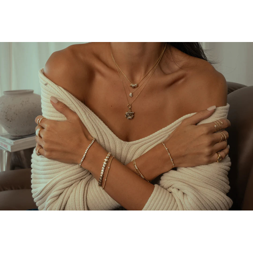 Monisha Melwani Fine Jewelry logo